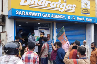 BJP youth front protests against corruption in Prime Minister's Ujjwala Yojana in raiganj , north dinajpur