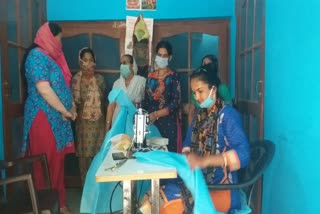 Women making PPE kits in Paonta