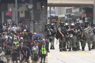 Hong Kong police fire volleys of tear gas at protesters