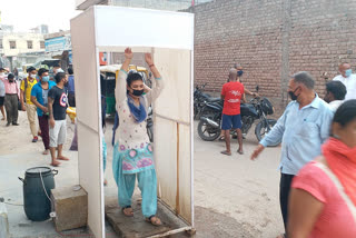 Sanitization machine installed at entry gate for the people in pradhan enclave colony of Burari