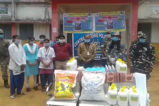 CRPF distributes sanitizer to villagers