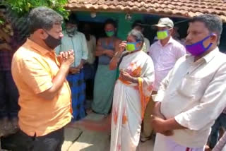 Renukacharya visits the home of a forest department employee who committed suicide