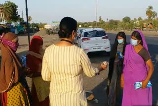 women distributing medicines