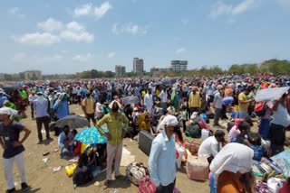 Thousands of migrant workers wait at Vasai to board special train