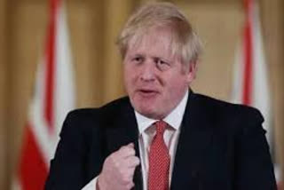 UK PM Boris Johnson backs top aide after lockdown revelations