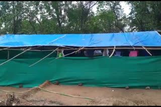 Villagers set up tents for servants