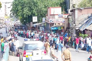 Crowd of workers to catch train in Dharavi to fuss of physical distance