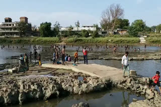 Crowd gathered at river