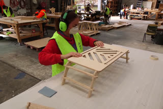 The staff of an Australian theatre stage building company 'Stagekings' are making desks for people working from home - and the business has even rebranded itself as 'Isokings', in Sydney.