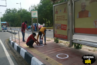 Circles being built for social distancing at bus stop in Delhi