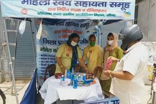 women selling masks and sanitizers through self help group in jind