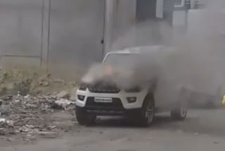 Fire in a parked car was brought under control by locals and fire brigade