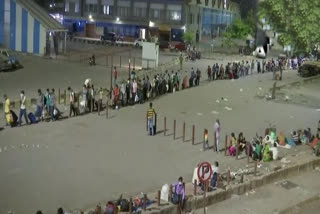 People wait for boarding 'Shramik' special trains at Mumbai's Lokmanya Tilak Terminus