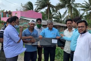 Suvendu Adhikari distributed tarpaulin Amphan affected areas