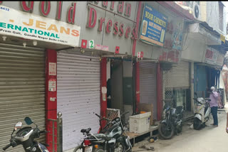 Shopkeepers emptying shop in Gandhinagar Market