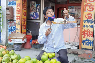 change profession photographer to fruit seller in Raigunj