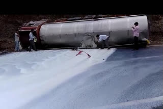 truck container filled with milk overturned