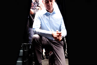 Joined by community faith leaders Los Angeles Mayor Eric Garcetti takes a knee in prayer during a Black Lives Matter protest in downtown Los Angeles, on Tuesday.