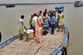 Monks are delivering food to the starving people on Mausuni Island