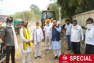 People repairing road by collecting donations