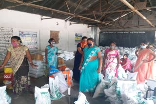 Women preparing CM food packets in Hazaribag