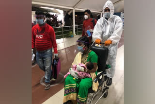 The newborn with parents at airport