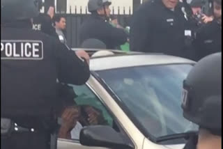 LA police break car window, pull man out