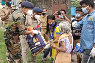 On the environment day, the ranger of the forest department gave plants and food items to the old women of the red light area in jalpaiguri