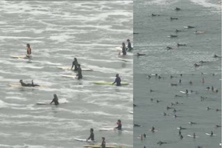 Surfers gathered along the beach in Santa Monica, California for a paddle out event.