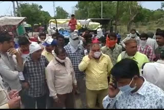 Farmers waiting for sale outside the procurement centers made a check