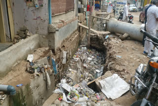 People are troubled by plight of Mangal Bazar Road  open drains in Sangam Vihar