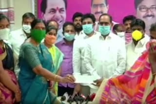 MLA Ramulu Naik Distributes Cheques