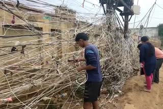 People connecting wires