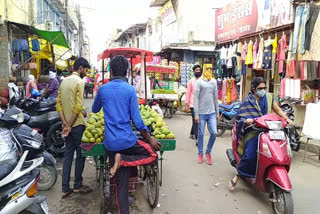 People wearing masks in the market