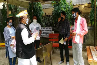 MLA Vijender Gupta distributed masks and letter