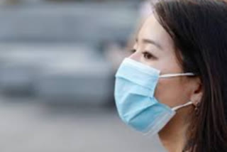 Widespread face mask use could prevent