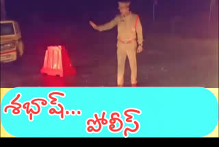 police working in rain at garikapadu check post