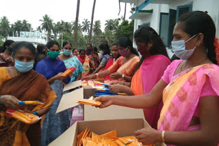 teacher distributing sanitary pads, napkins to poor ladies in ravulapalem constituency