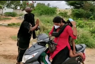 person giving corona awareness for passengers with out wearing masks in ananthapur district