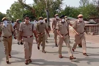 Dholpur news, Police foot march, curfew rules