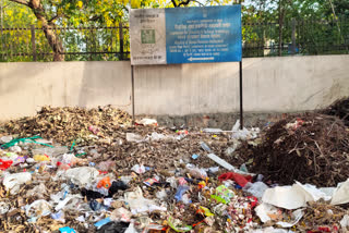 Litter garbage placed under the Prime Minister Sanitation  Message Board