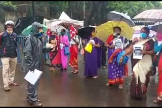 CPIM protests in pouring rain to provide relief to poor families