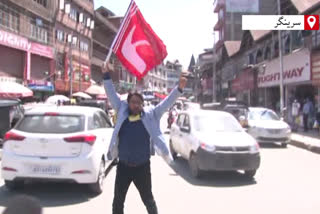 pdp leader nazir yatoo tries to hoist jammu and kashmir's flag in lal chowk