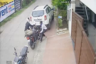 Accused carrying bike
