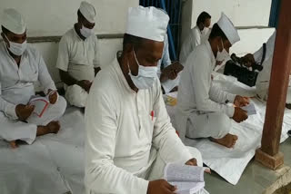 Prisoners reading books in jail