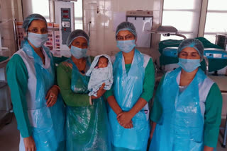 Nurses with baby girl