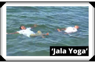 Two men practice 'Jal Yoga' in Rameswaram on International Yoga Day 2020