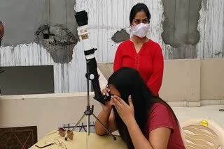 Woman looking at the amazing view of solar eclipse from telescope