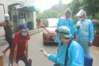 Doctors treating patients outside the building at Rohini ESI Hospital