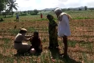 Farmers protesting with a bottle of poison